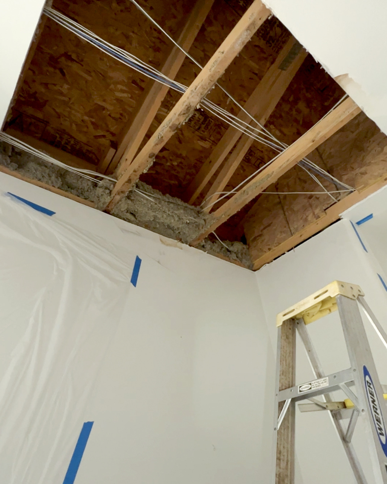Ceiling opened after damaged drywall and compromised material were removed.