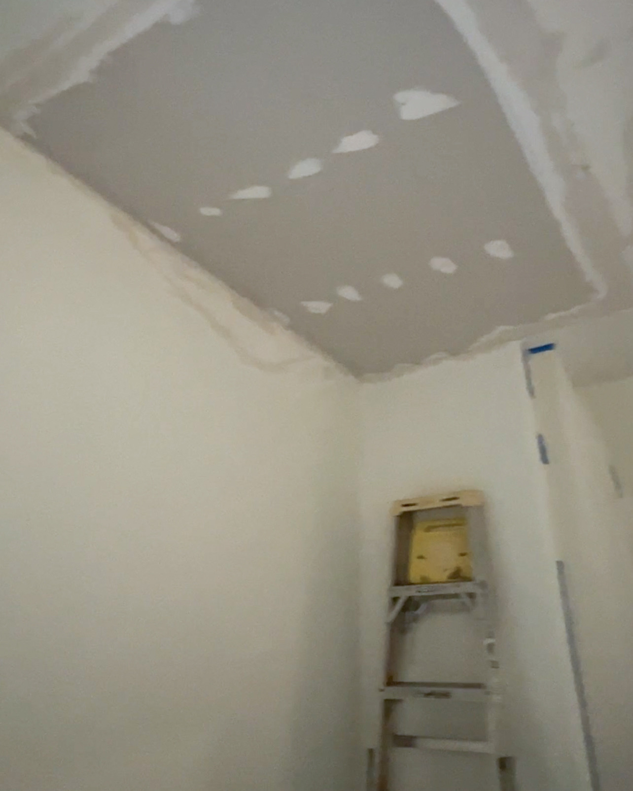Fresh ceiling drywall installed and prepared for seam finishing.