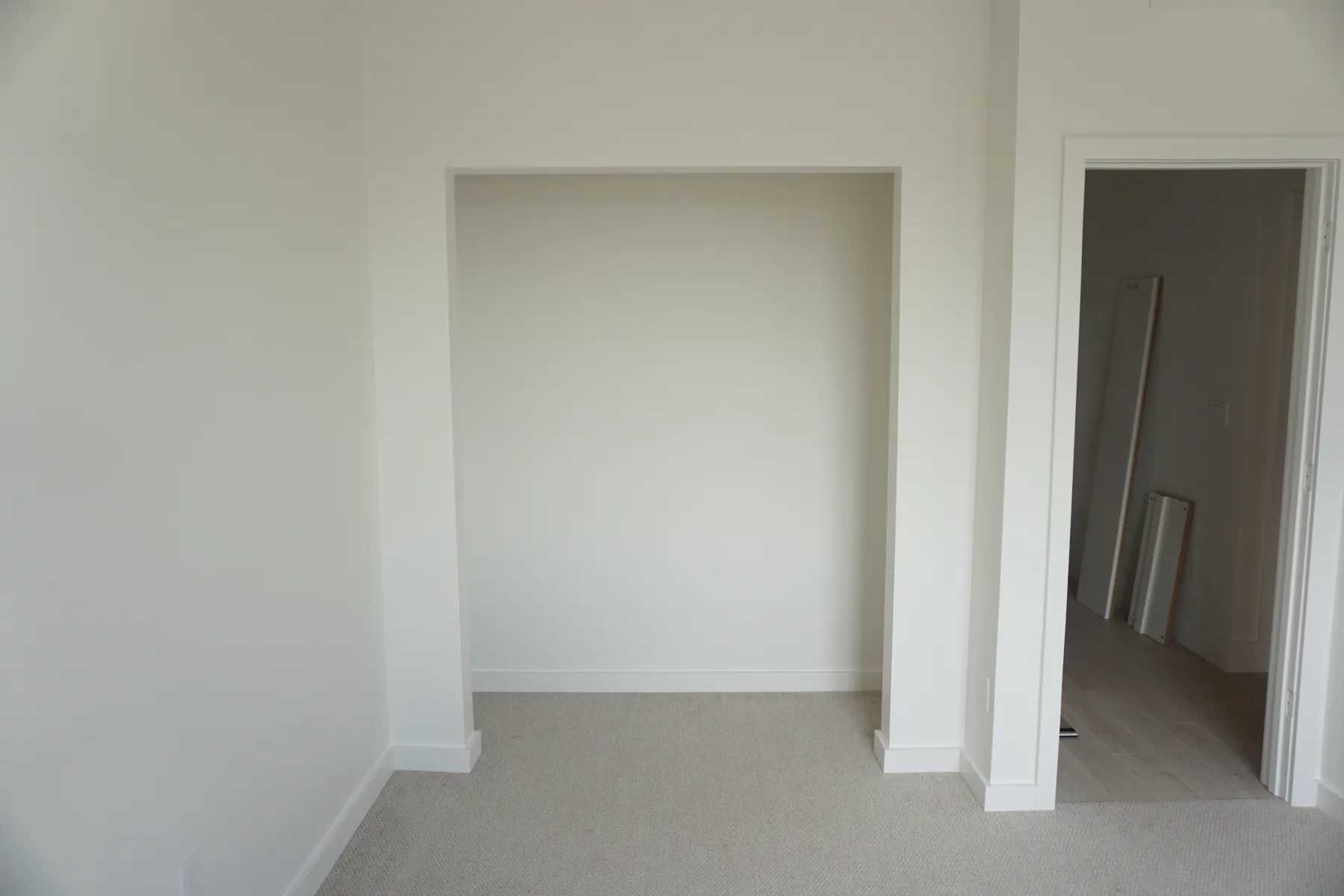 Empty recessed kids closet before custom storage was installed.