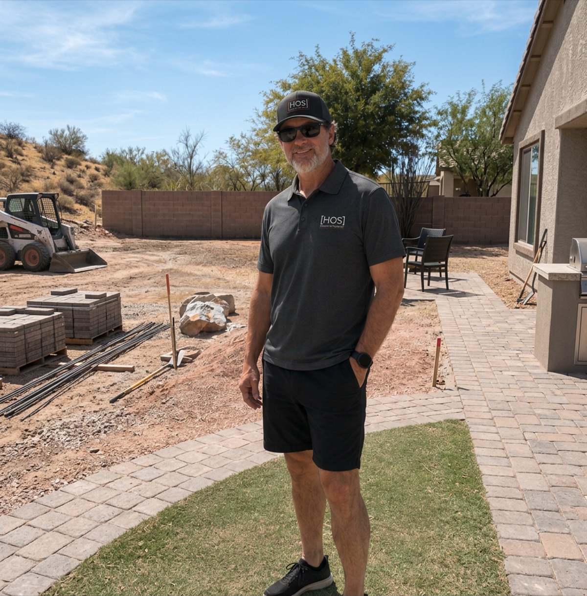 Kevin Sarault on a residential jobsite wearing House of Sarault workwear.